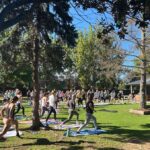 Group of people doing yoga outside