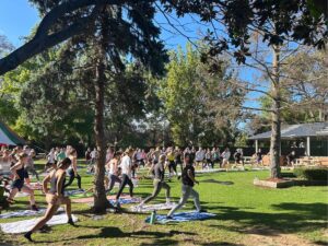 Group of people doing yoga outside