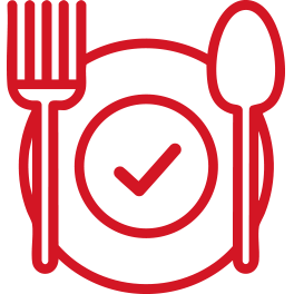 Red fork, spoon and plate icon. There is a tick in the middle of the plate.